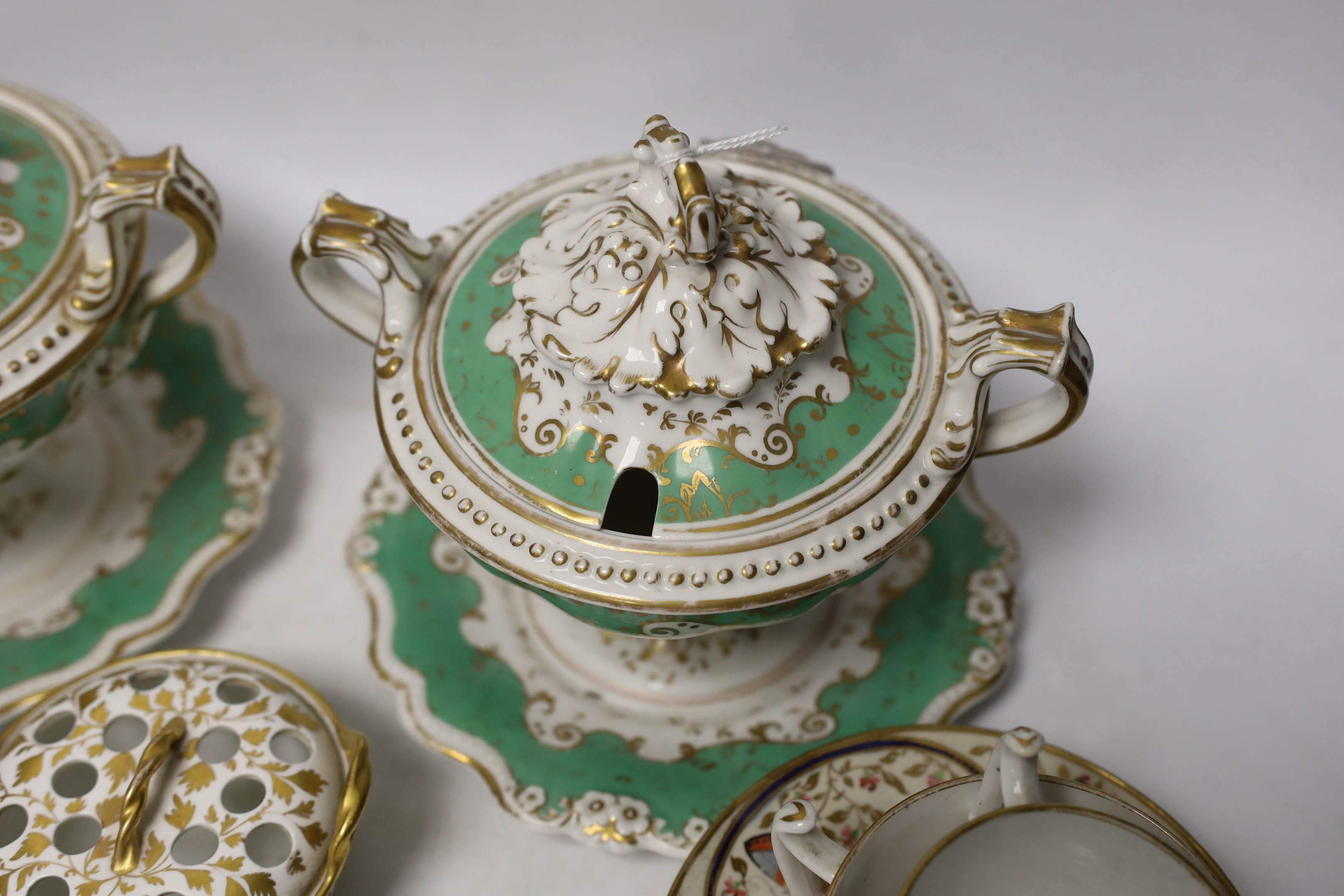 Early 19th century English porcelain including a Wedgwood pot pourri bowl and cover, two sauce tureens covers with integral stands, a butterfly painted trio and a bird painted spill vase